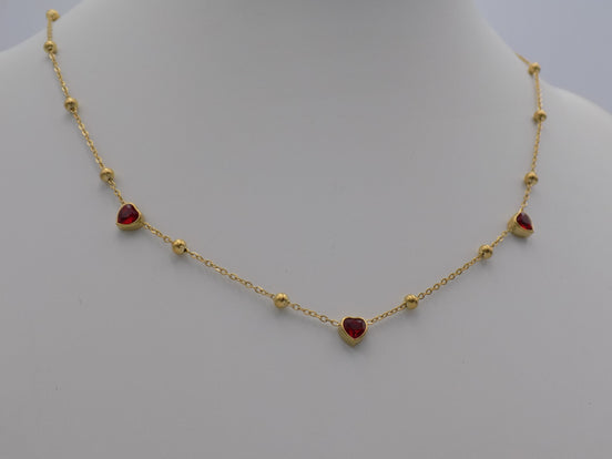 Gold Tone Station Necklace with Red Crystal Hearts