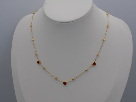 Gold Tone Station Necklace with Red Crystal Hearts